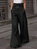 Victoria Lumina Wear black wide-leg trousers with relaxed fit, showcasing a stylish and comfortable pant style.
