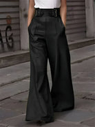 Victoria Lumina Wear black wide-leg trousers with relaxed fit, shown on a model, featuring a sleek, stylish silhouette.