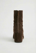 Dark brown women's ankle boots by Lumina with a sleek design and block heel, featuring a chic, modern silhouette.