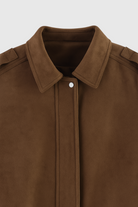 Victoria dark brown suede bomber jacket with zipper closure from Lumina Wear, featuring a stylish, fitted design and ribbed cuffs.