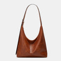 Brown Lumina Wear Victoria commuter tote handbag with ample storage, durable design, and chic style for everyday use.
