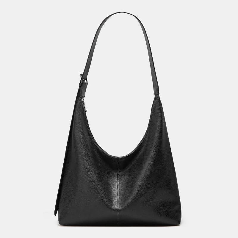 Lumina Wear Victoria commuter tote bag in brown, featuring durable construction and spacious interior for everyday use.