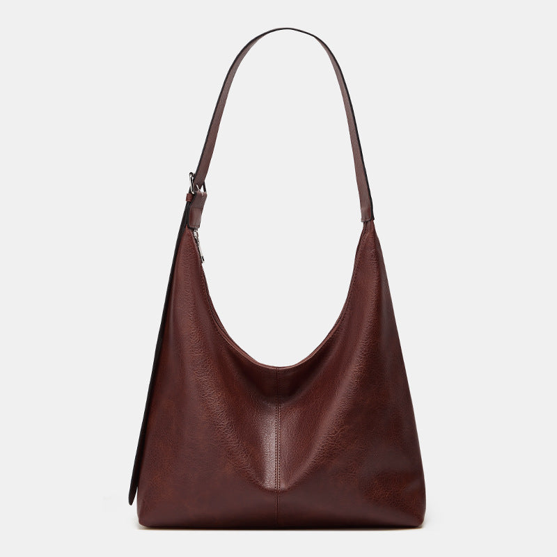 Lumina Wear Victoria commuter tote bag in brown with durable design and ample storage for everyday use.