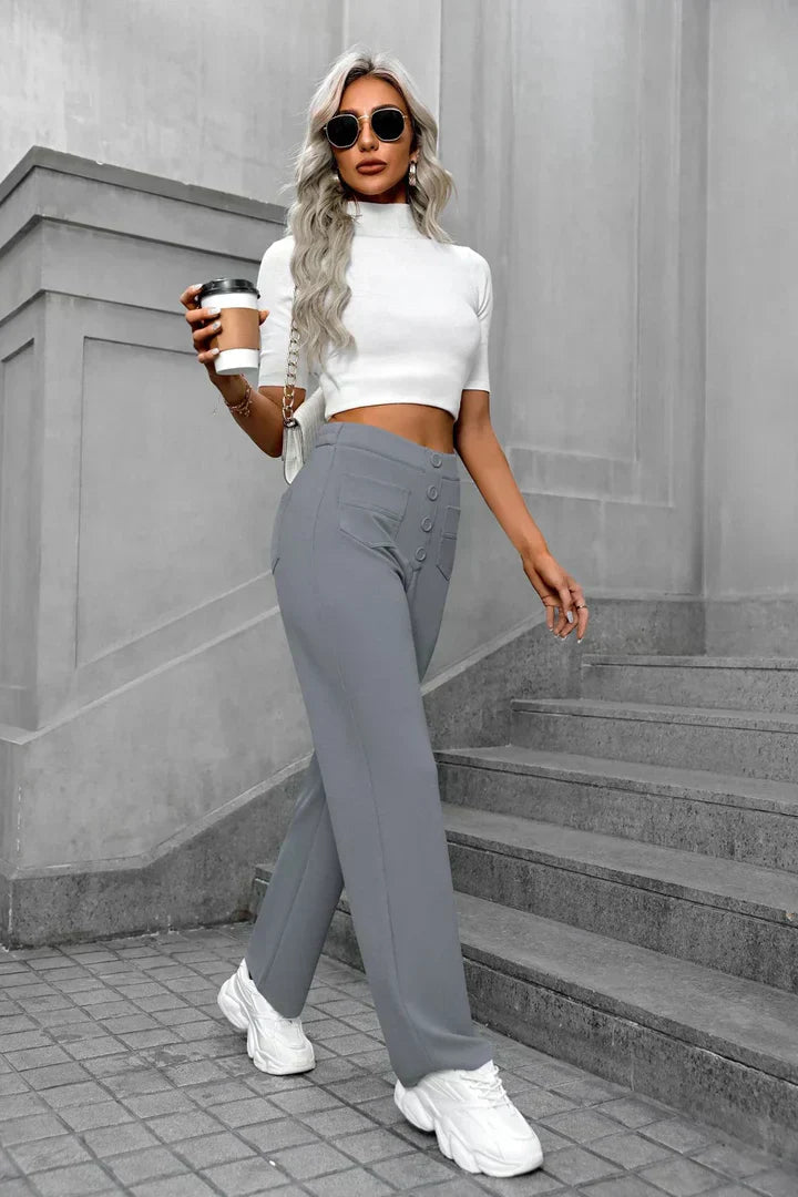 Victoria Lumina Wear high-waisted trousers in stone green with stretch fabric, styled for a chic, tailored look.