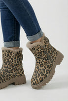 Lumina Wear Victoria leopard ankle boots with cozy lining, brown fur pattern, stylish ankle height, and sturdy sole.