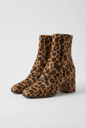 Victoria Lumina leopard print ankle boots with retro heel, stylish women's footwear featuring bold animal print and vintage-inspired design.