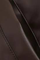 Brown loose fit aviator jacket for women by Lumina Wear, featuring a stylish design and comfortable fit.
