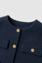 Victoria women’s navy short jacket by Lumina Wear featuring a chic modern silhouette and lightweight fabric.