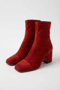 Red Victoria Lumina Wear mid-calf boots for women with chic retro style and statement heel, showcasing stylish leather design.