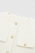 Lumina Wear Victoria white tailored short jacket with versatile style, shown on a model, perfect for chic casual or dressy looks.