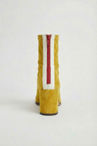 Victoria Lumina yellow mid-calf boots for women with warm lining, stylish footwear with a sleek design and cozy interior.