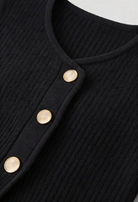 Black knit cardigan for women by Lumina Wear featuring cozy fabric and ribbed details, perfect for layered, casual outfits.