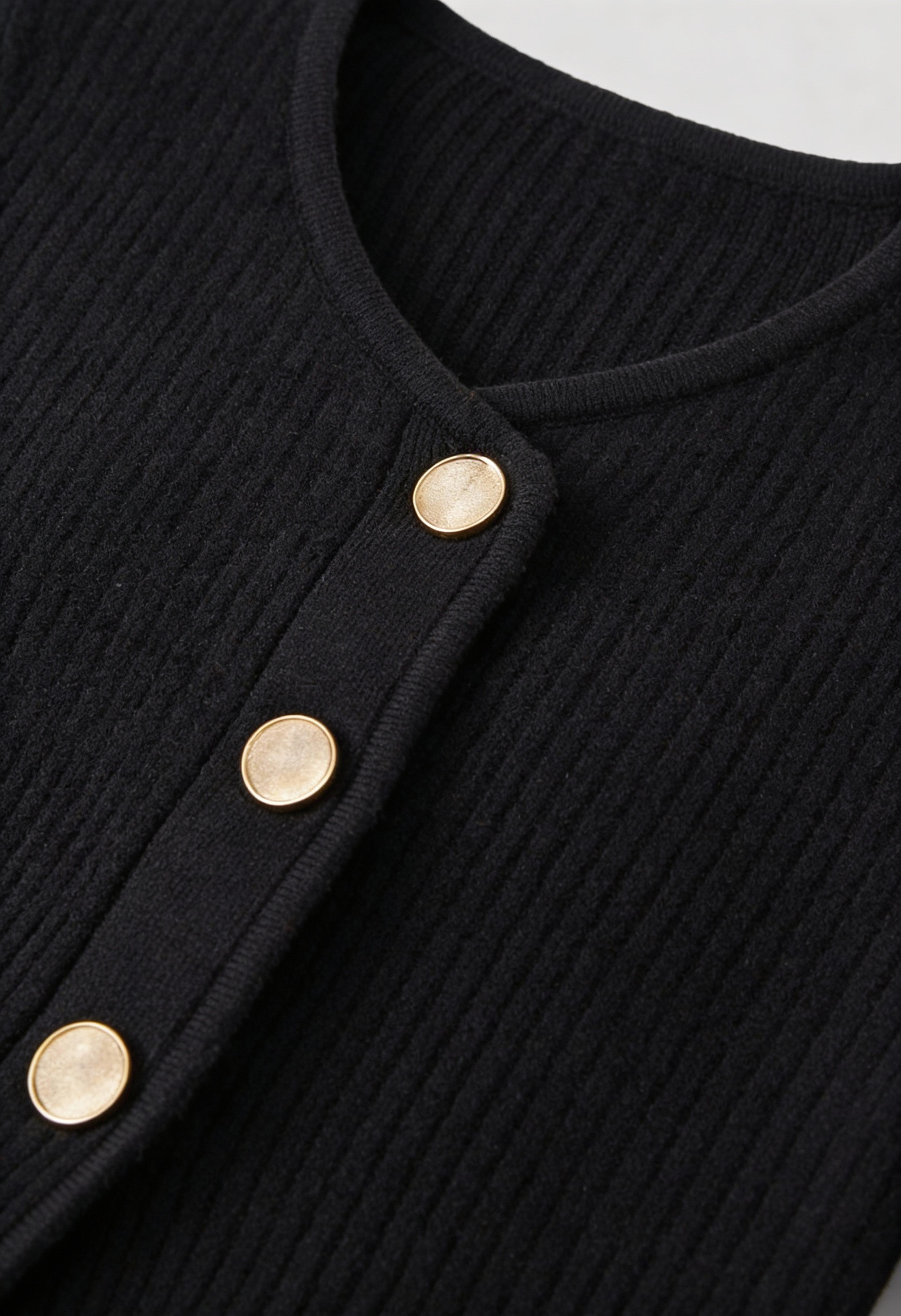 Black knit cardigan for women by Lumina Wear featuring cozy fabric and ribbed details, perfect for layered, casual outfits.