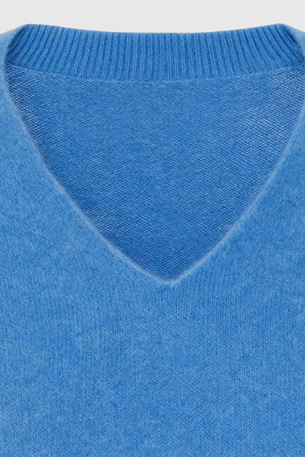 Blue Victoria Lumina Wear women's V-neck sweater with a cozy, flattering fit, perfect for casual and layered looks.