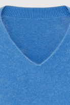 Blue Victoria Lumina Wear women's V-neck sweater with a cozy, flattering fit, perfect for casual and layered looks.