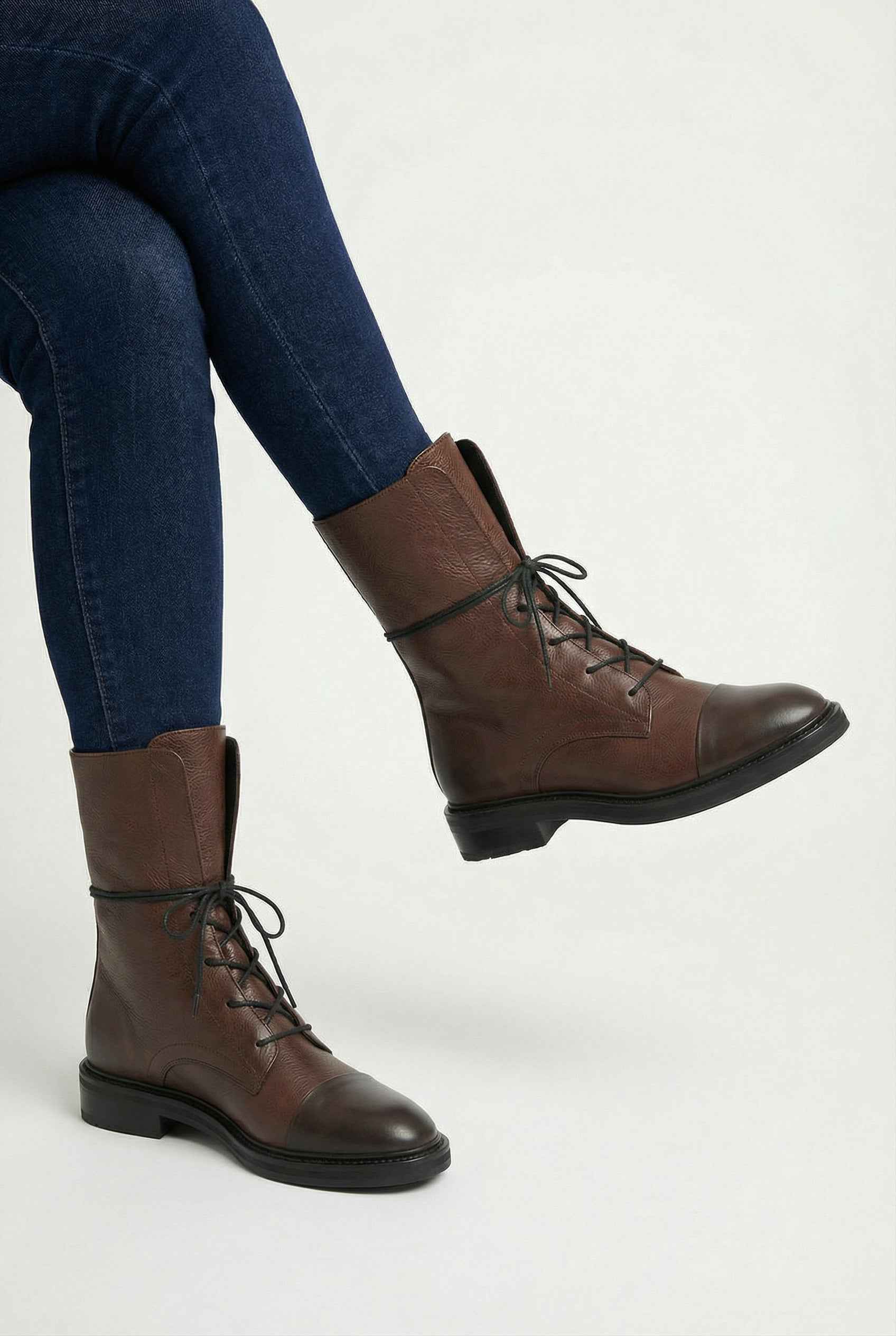 Dark brown Lumina Wear Victoria lace-up ankle boots featuring chic detailing and cozy design with a stylish silhouette.