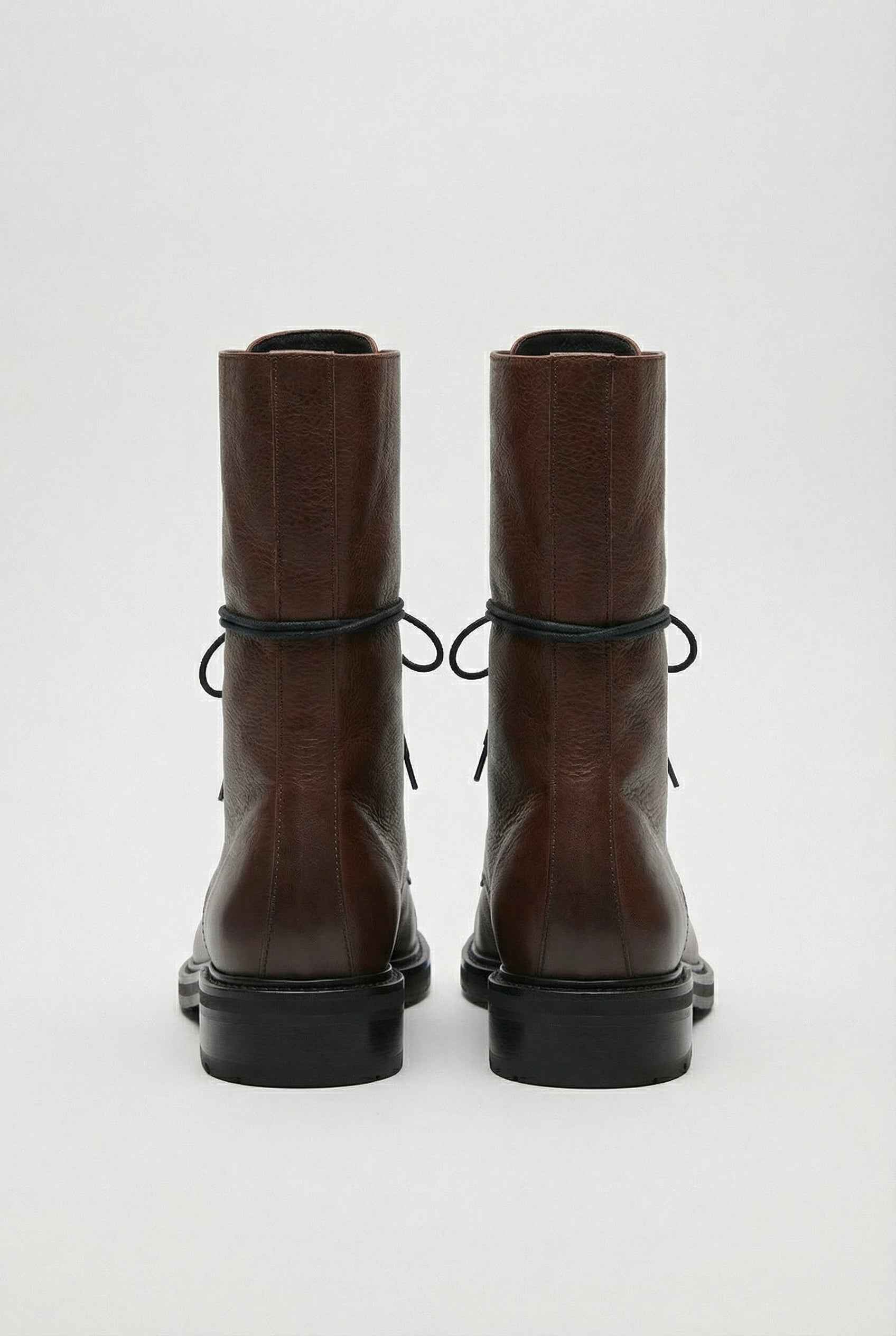 Dark brown Lumina Wear Victoria lace-up ankle boots with chic detailing and cozy design, perfect for stylish casual wear.