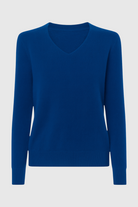 Dark blue Victoria Lumina Wear V-neck sweater with a cozy, flattering fit, shown on a model.