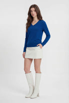 Dark blue Victoria Lumina Wear V-neck sweater with a cozy fit, perfect for casual and stylish winter outfits.