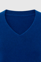 Victoria Lumina dark blue V-neck sweater with a flattering fit, cozy knit, and stylish design, perfect for casual wear.
