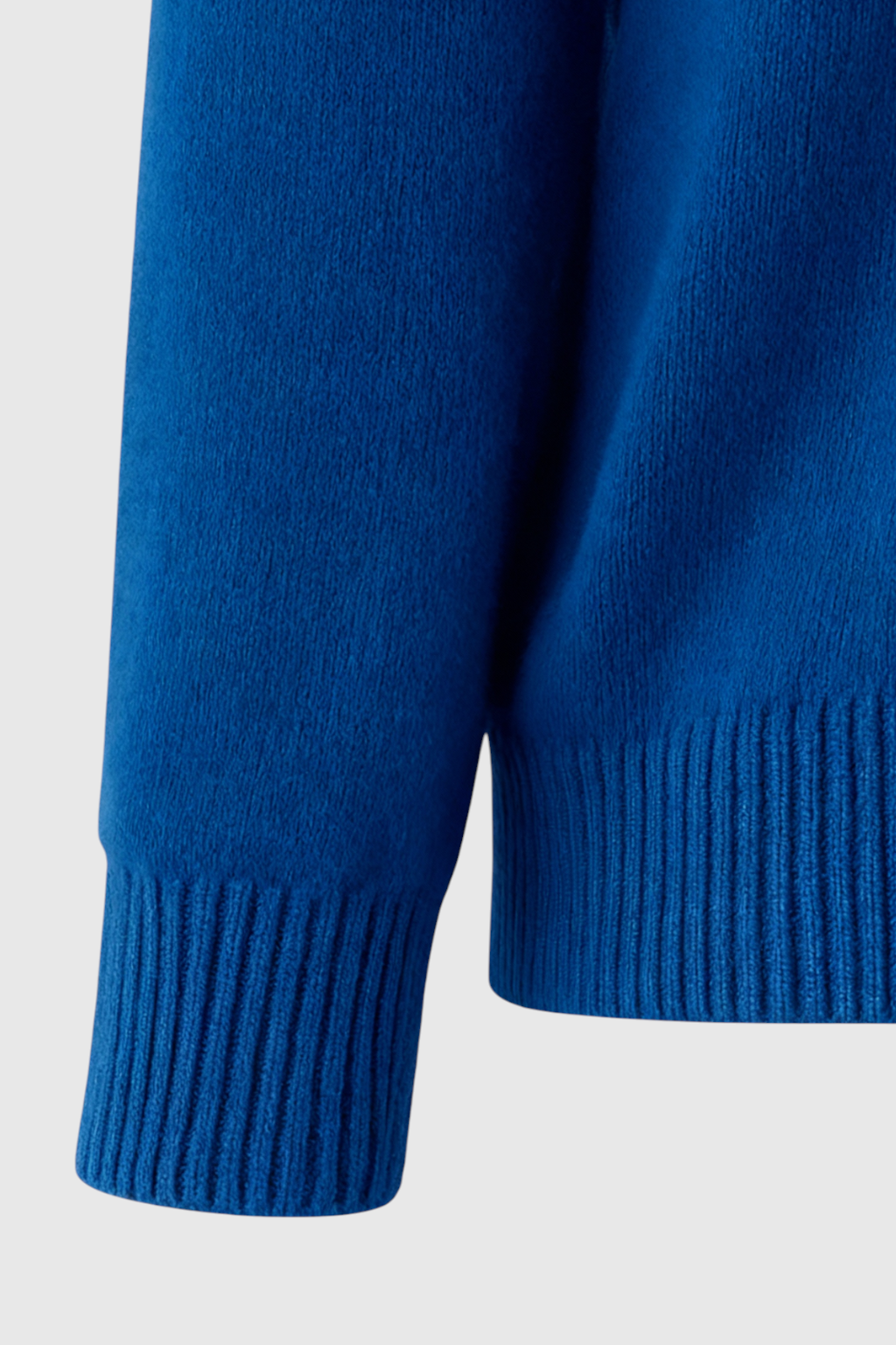 Dark blue Victoria V-neck sweater by Lumina Wear, featuring a cozy fit and flattering silhouette, worn casually.