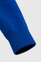 Dark blue Victoria Lumina Wear V-neck sweater with flattering fit, cozy knit, and long sleeves, casual and stylish for everyday wear.