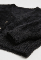 Victoria Lumina cozy long black cardigan sweater with open front design, featuring a relaxed fit and soft knit fabric.