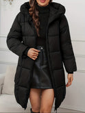 Red-brown Lumina Wear Victoria longline hooded puffer coat with practical pockets, cozy and warm for cold weather.