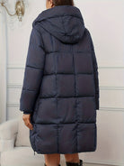 Lumina Wear Victoria cozy longline hooded puffer coat in reddish-brown with practical pockets, stylish winter outerwear.
