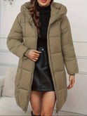 Lumina Wear Victoria cozy longline hooded puffer coat in reddish-brown with practical pockets, perfect for cold weather.