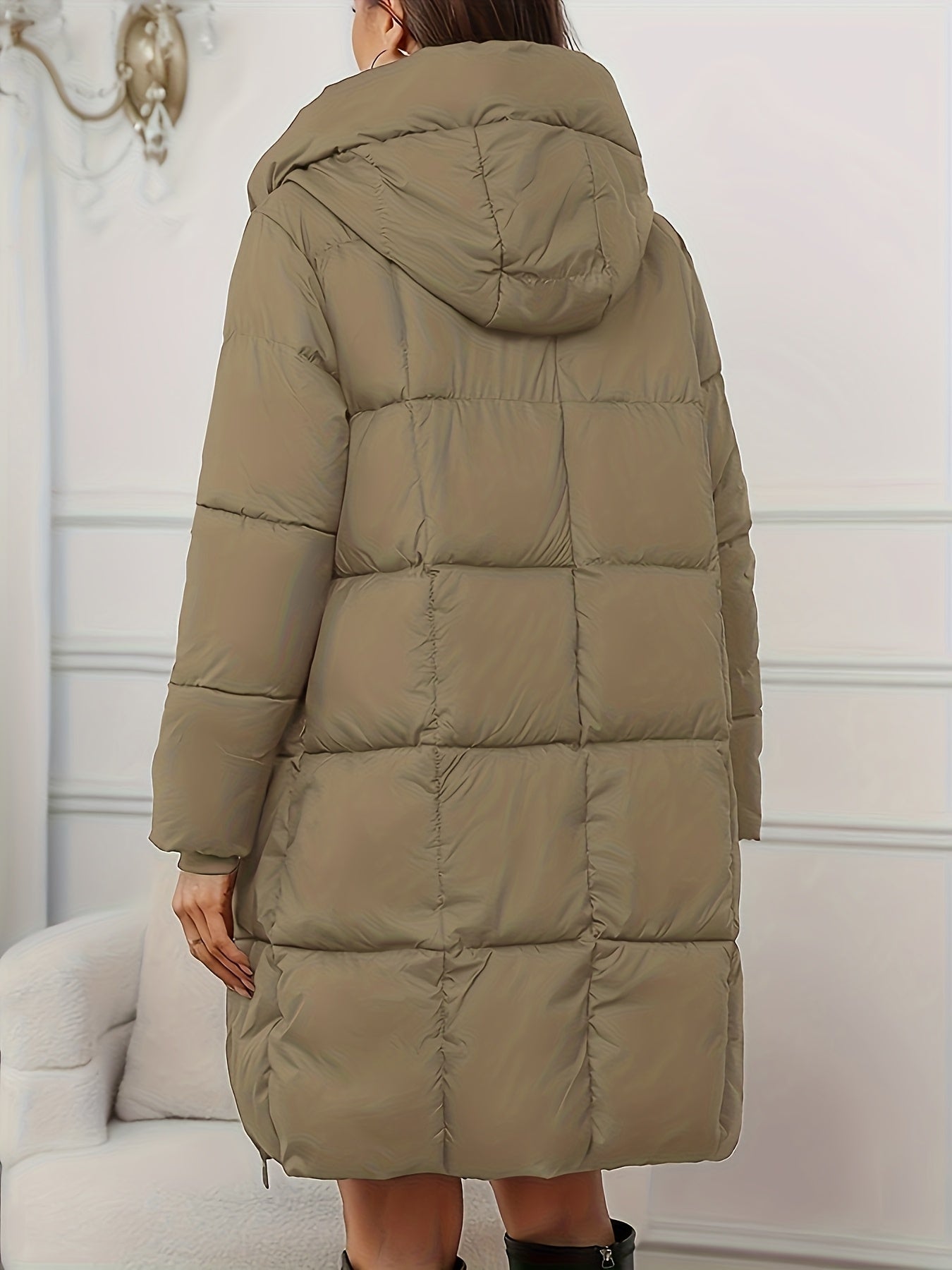 Redish-brown Victoria Lumina Wear longline hooded puffer coat with practical pockets, cozy and insulated for cold weather.