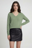Olive green Lumina Wear Victoria cozy sweater with flattering V-neck, long sleeves, and soft knit fabric, front view.