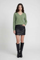 Olive green Lumina Wear Victoria cozy sweater with flattering V-neck, soft knit, and relaxed fit, ideal for casual styling.