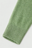 Olive green Lumina Wear Victoria cozy sweater with flattering V-neck, long sleeves, and soft knit fabric for a stylish, comfortable look.