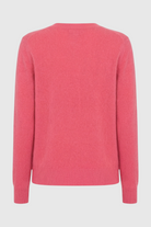 Victoria Lumina Wear cozy pink-red V-neck sweater with a flattering fit, featuring soft knit fabric and stylish design.