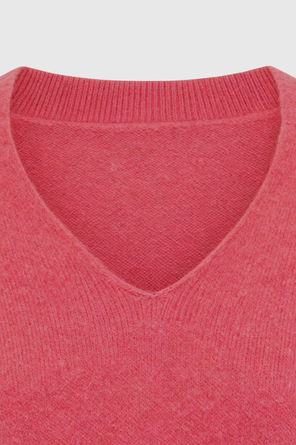 Pink and red V-neck sweater from Lumina Wear, cozy fit, with a flattering silhouette, perfect for casual or stylish wear.