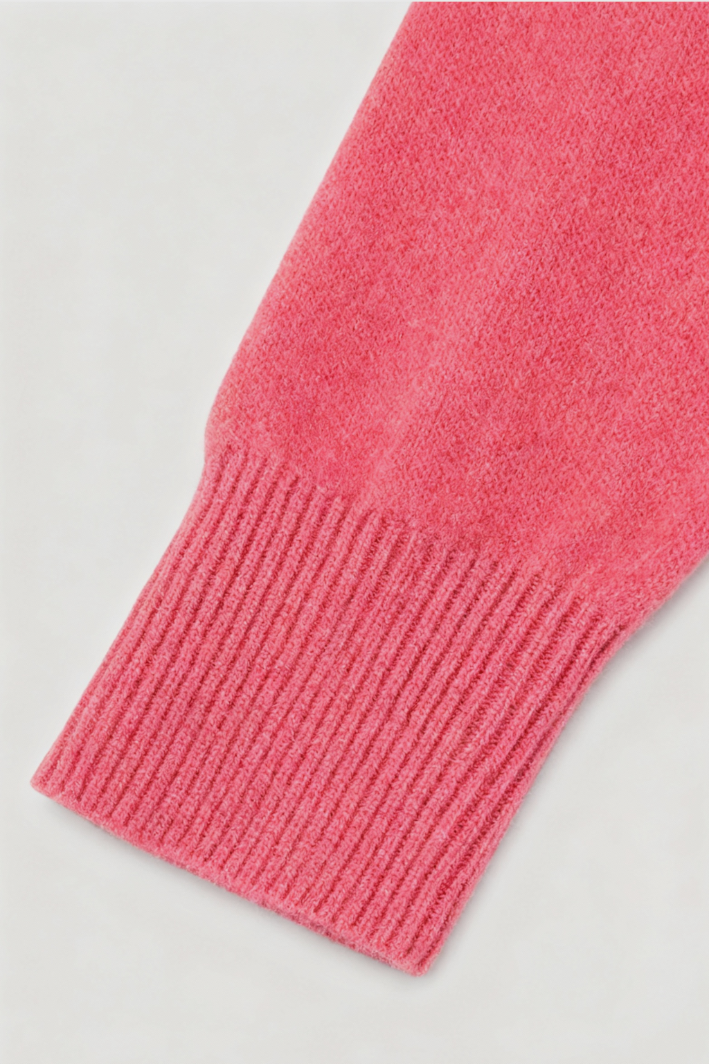 Lumina Wear Victoria pink and red V-neck sweater with a cozy fit, featuring a flattering silhouette and soft knit fabric.
