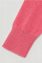 Lumina Wear Victoria pink and red V-neck sweater with a cozy fit, featuring a flattering silhouette and soft knit fabric.