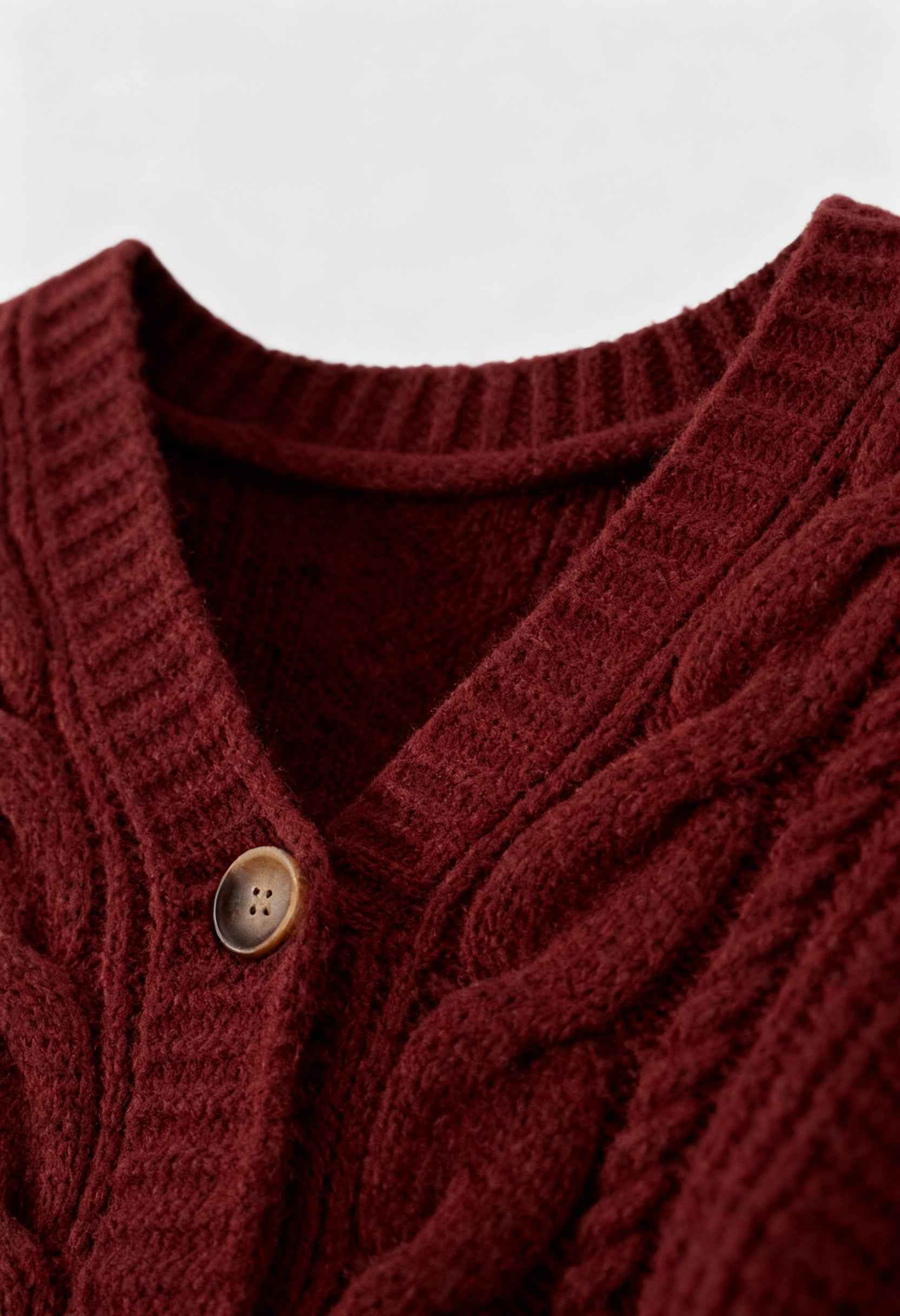 Victoria cozy red long cardigan by Lumina Wear featuring ribbed details, soft knit fabric, and a relaxed fit.
