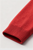 Lumina Wear Victoria cozy red sweater with a flattering fit, showcasing soft knit fabric and stylish design on a model.