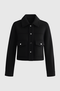 Elegant black Victoria jacket with button closure by Lumina Wear, showcasing a stylish tailored design for women.