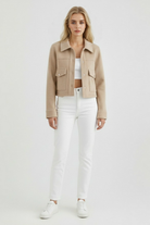 Elegant Lumina Wear Victoria autumn jacket with classic button closure in apricot, featuring stylish design and tailored fit.