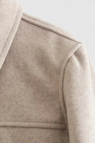 Lumina Wear Victoria elegant autumn jacket with classic button closure in apricot color, stylish and lightweight for chilly days.