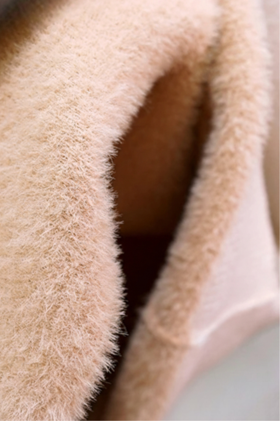 Elegant beige Lumina Wear Victoria slim fit turtleneck sweater for winter, shown on a model highlighting its cozy fit and stylish design.