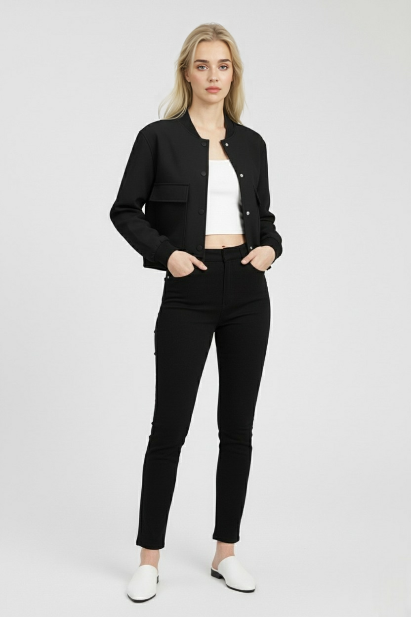 Elegant black bomber jacket from Lumina Wear featuring a timeless design, shown on a model with stylish urban background.