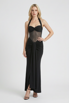 Elegant black halter dress by Lumina Wear featuring a sculpted silhouette for women, showcased on a model.