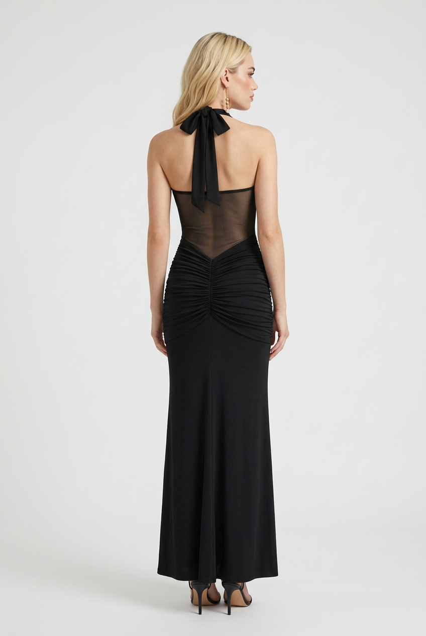 Elegant black halter dress by Lumina Wear featuring a sculpted silhouette, showcased on a model. Perfect for formal occasions.