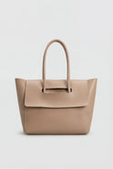 Elegant black Lumina Wear handbag with adjustable strap, stylish design, and spacious interior for versatile everyday use.
