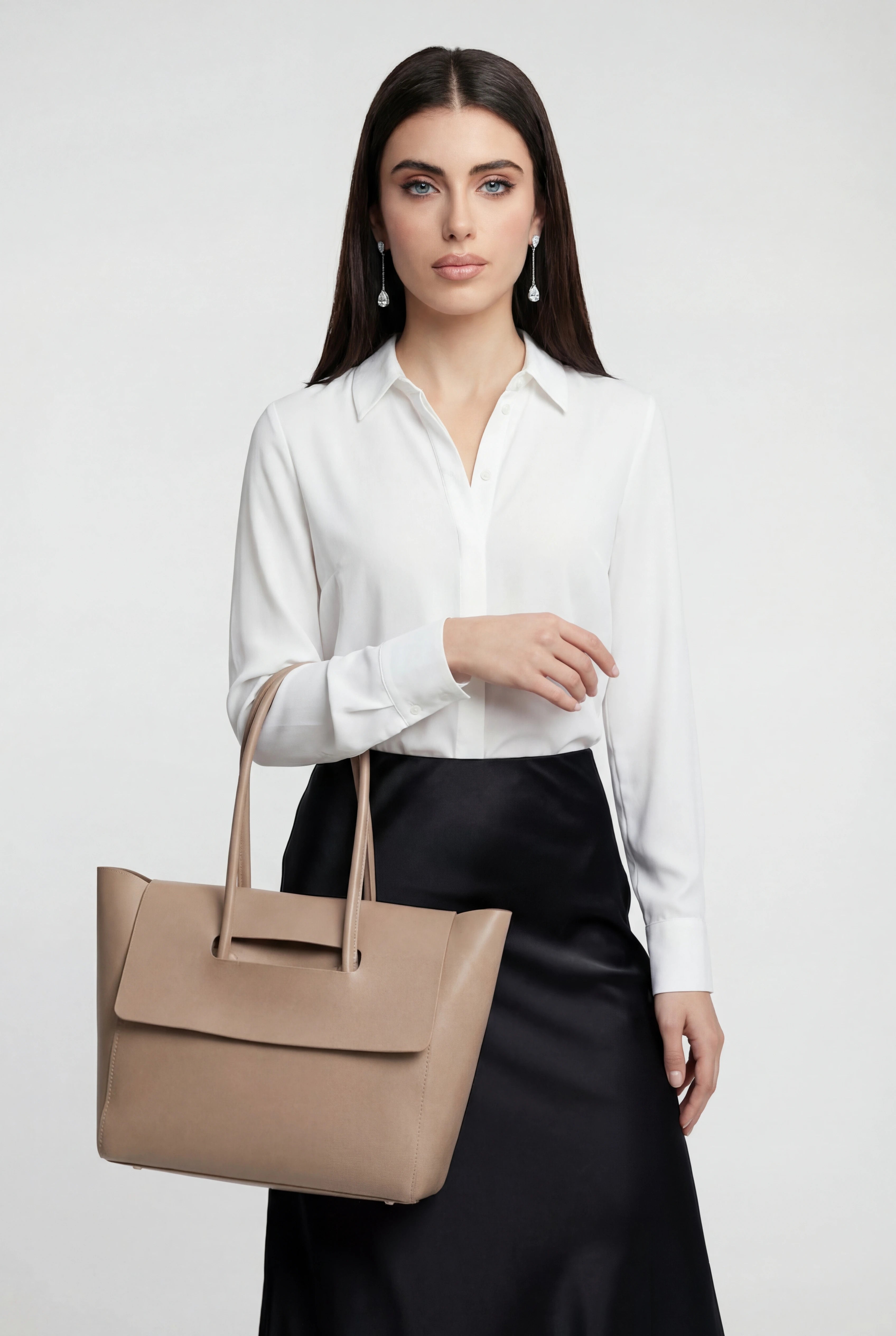 Elegant black Lumina Wear handbag with adjustable strap, featuring a sleek design and stylish accents for versatile carrying.