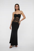 Elegant black lace evening gown with a mermaid hem by Lumina Wear, featuring intricate lace detail and a fitted silhouette.
